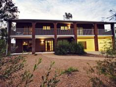  37 Hillside Gardens Desert Springs NT 0870 Double Delight A two storey home that the kids will love! Impressive from the street there is space for everyone and some left over.  Chequered floor tiles make a statement at the entrance with a formal living area and fourth bedroom also at ground level. A slow combustion heater on the mezzanine floor keeps the home cosy in the winter and split systems as well as evap air cover the summer months. An abundance of glass offers fabulous views from the kitchen and family room over the landscaped gardens, swimming pool and parklands beyond. Timber decking spans from the living areas giving further outdoor entertaining options. Three more bedrooms are on the top floor and all have French door access to the front balcony and southern range views. The main bedroom comes with a walk in robe and ensuite bathroom. For convenience there is a third toilet. A double carport and plenty of under home storage adds to the value. General Features Property Type: House Bedrooms: 4 Bathrooms: 2 Indoor Features Split-system Heating Air Conditioning Outdoor Features Carport Spaces: 2 Balcony Other Features Formal Dining Room, Formal Lounge, Inground Pool, Outdoor Living, Range Views, Reticulated Garden, S 