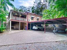  25 Cockatiel Pl Currumbin Waters QLD 4223 This federation styled home on 6,775m2 is located at the end of a very quiet cul-de-sac street in the Currumbin Valley. The owners have obtained approval for a second home on the property and have the plans available for inspection. * Four large bedrooms, three bathrooms, ensuite to the main; * Timber floors throughout and a country style timber kitchen with modern s/s appliances; * Separate living, dining and rumpus areas, high ceilings, airconditioning; * Entertaining areas with a huge pergola at the rear; * Massive deck and verandah area at the front accessed through french doors; * Parking for three cars, workshop area underneath; * The property has complete privacy. This is a very rare opportunity for hte future and is a must for inspection. 