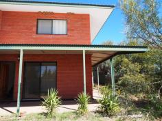  4/5 Aneura Pl Sadadeen NT 0870 This unit is too good to pass up with the First Home Buyer Grant coming to an end in December 2014. Get in before the end of the year to get your $25,000 grant! You will feel the benefit in your back pocket of a privately managed body corporate. With this you are essentially just paying the raw costs of water and insurance and none of the other costs that come with a managed unit complex. Positioned at the back of the complex and sitting on a hill, this great two bedroom townhouse is worth a look for both its great design and great views!  The open plan tiled living/dining and kitchen boasts ducted evaporative air conditioning throughout and ceiling fan. Downstairs the internal laundry also has an extra toilet. The kitchen features gas cooktop and oven, plenty of cupboard and bench top space and sliding door that leads out to the backyard.  Upstairs the main spacious bedroom boast ceiling fan, built in robes, carpet and large private balcony with fabulous views of the Ranges. The other bedroom also features ceiling fan, split air con, built in robes and carpet. The central bathroom has bath over shower, vanity and toilet inclusive.  Outside, the veranda runs along the front and continues around the side so there is plenty of choice of where to sit and enjoy the outdoors. There's enough room for a vege patch too. The unit features a single car spot with plenty of other parking spots and the benefit of a privately managed body corporate which will help keep your costs down!  Call for a viewing today! 