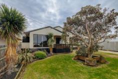  51 Powling St Port Fairy VIC 3284 Internet ID 305148 Property Type House Features Spa, Heating - gas, Remote garage, Secure parking, Dishwasher, Built in robe/s, Rumpus, Floorboards, Shed, Fully fenced, gas hot water service, Deck Don't judge a book by its cover !You will be amazed at what's behind this interesting facade. On entering this homely family residence, you will be greeted with an open, yet warm and cosy feel. Ticking all the boxes in location, aspect, appeal and value. Youre literally within walking distance to the beach, schools, healthcare and town centre. The generous allotment of 794m2 of land allows you plenty of space to play both inside and outside in this renovated family home.  The interior has been upgraded with neutral colours and features a mixture of Tassie oak flooring, tiles and carpet. There are 4 bedrooms all with robes (master with WIR and ensuite), central bathroom with corner spa bath and large walk through laundry. There are multiple living zones which is perfect for families, remaining separate yet connecting easily for that free flowing living appeal. A large open plan functional Kitchen /Dining area with a glass sliding door out to an outdoor alfresco entertaining space including a large Jackaroo BBQ.  The entire yard is neat and tidy with a great sunny East / West aspect and fully secured by quality fencing. A tandem carport with remote door and access through to rear yard where there is an additional 10 x 4 shed with power.  Dont make your judgement on this one until you walk through the front door as its full of surprises ! 