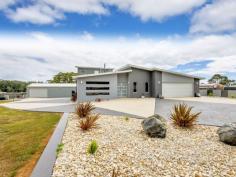  128 Lennah Drive WYNYARD TAS 7325 A home of perfection awaits its new owners, set atop this new rural subdivision on 1.235 HA (3.05 acres approx.) is this large split level home that is a testament to the owners dream. The kitchen is fully appointed and has quality appliances and solid polished concrete bench tops. There is 4 very large bedrooms with the master on the upper level with full ensuite, full wall of built-ins and your own private deck. The living area is open and spacious and offering unbelievable views over Wynyard to Table Cape. The alfresco dining area has sliding doors to patio and makes an awesome entertaining BBQ area. The large double garage has internal access. Outside is well maintained lawns, gardens and loads of concrete both coloured and aggregates for ample parking. There is also a 15m x 8m x 4m high workshop with wood heating and toilet that would suit the handyman and ideal for the boat or caravan. With the Wynyard township and airport just minutes away this property is surpassing all expectations. Read more at http://wynyard.ljhooker.com.au/8XAFD3#G82yq8WVkwSWXJZC.99 