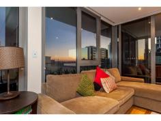  21/155 Adelaide Terrace East Perth WA 6004 TWILIGHT OPEN, 5.30 -6pm, Wed, 24th PRICE SLASHED! LAST CHANCE or OWNER WILL LEASE! Stunningly situated on Level 10 of the ultra-modern “Rise” complex, this immaculate two-bedroom two-bathroom apartment defines easy inner-city living and enjoys peace, tranquility and security whilst boasting breathtaking river and city views from a massive wrap around 40sqm balcony and within. Polished Blackbutt timber floorboards lend a low-maintenance feel throughout the home and creates a smooth flow, linking the sleeping wing to the open-plan living and dining area where a spacious kitchen is incorporated into the airy design. The main living zone and both bedrooms each have their own individually-controlled split-system air-conditioners, including a sumptuous master ensemble with mirrored built-in wardrobes, access out on to the balcony for entertaining and a private and stylish ensuite bathroom with a shower, toilet and twin stone vanities. The Guest bathroom-come-laundry services guests and the Guest bedroom that also provides balcony access, whilst the kitchen is luxuriously-equipped with a sparkling stone island bench top, quality glass splashbacks, a Bosch electric cook top, oven, exhaust and a Miele dishwasher. Absorb the sun glistening or the night city lights reflecting on our picturesque Swan River and choose to either nest or invest in this East Perth gem, just footsteps from convenience stores, cafes, Langley Park and more. With free buses along St George’s Terrace, this is your gateway to our vibrant CBD! Other features include: • 2 bedrooms, 2 bathrooms * Level 10 * Very generous 89sqm of internal living with separate sleeping wing • Shower, toilet, twin stone vanities and laundry appliances in Guest bathroom • L-shaped alfresco balcony for entertaining and quiet contemplation whilst indulging in mesmerising views of our beautiful Swan River and its city surrounds • Audio intercom system, secure lift access from Grand Lobby entrance • Feature down lighting • Quality blind fittings throughout • Shadow line cornices • Moments from Perth train station, free city CAT buses, cafes, restaurants and shopping * Resort facilities include a resident’s lounge/function room, a shimmering infinity-style lap swimming pool, sauna, spa and gym – and there is also one secure car parking bay plus storage available. * Anticipated Rental Return $750 per week Invest in the East Perth precinct now before more than $3.5 billion worth of infrastructure is completed, including the new Waterbank project located only two blocks from 175 Hay Street, as well as the new Perth City Link, Elizabeth Quay, Perth Light Rail System (MAX), the new Pedestrian Bridge pass to Crown Casino and much more OUTGOINGS: Water Raters: $1,155 per annum Council Rates: $1,502 per annum Call Melissa Green on 0437 702 708 today to arrange your viewing Area: 90 Sqrs Land:: 144 Sqms Features larger balcony • ample storage • polished floorboards • 3x AC units • Ensuite • Outside Spa • Remote Garage • Swimming/Lap Pool • Intercom • Gym • Polished Timber Floors • Dishwasher • Courtyard • Built-ins • Balcony • Air Conditioning •  