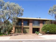  13 Thiele Ave Loxton SA 5333 Placed on the high side of the road, taking in the views of our 
beautiful river, this large solid built family home is adaptable to a 
number of uses. The two levels of this home make for convenience, as 
well as enjoyment. Its refreshing layout allows you to keep the more 
private recesses of your home for the personal use and eyes of just 
yourself and your own family. For the large family to enjoy there
 is an accommodating double under main roof garage with internal access 
into the front lobby, along with an enormous entertaining area with its 
own bathroom. Plenty of storage space can also be found on this first 
level. As you travel upstairs you will be bathed in light from 
the glass windows which are placed to make use of our natural resources.
 Once on the second level you will find a very large lounge (with 
combustion fire), a dining area and kitchen, from all this great space 
you will be able to take in the views from the floor to ceiling windows 
and doors. There is also a large room in this area, which you can make 
into your own private dining area, or just another great family 
entertainer. At your leisure, you may desire to simply go out and take a pew from your balcony and just look, listen and enjoy. Further
 along you will discover three large bedrooms all with masses of 
built-in-robes, quality furnishings and two bathrooms, one for the 
children or guests, and the other in the form of an ensuite for the 
master retreat. The format of this home may also facilitate the 
option of running a home business or office with the downstairs area 
having its own services and upstairs being a fully equipped home! 
 Other features: Built-In Wardrobes,Close to Schools,Close to Shops,Close to Transport,Garden 