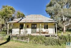  310 Old Stanley Road, STANLEY VIC 3747 HISTORIC STANLEY COTTAGE Sitting on the corner of Beechworth-Stanley Road and Old Stanley Road lies this quaint and cosy cottage, immersed in local history. Formerly the site in 1858 of Mr W.W. Wickens Junction Hotel, today it stands as a two bedroom home ideally located centrally between Beechworth township and Stanley village.  After restumping, rewiring and replumbing, the cottage has been tastefully renovated to include a modern kitchen, a huge walk in pantry, and split system inverter heating and cooling. For you romantics out there, you will find two open fire places for those snug nights in. Other period features include, dado panelling, timber lined ceilings in the bathroom and main bedroom, plus timber sash windows in the front of the house. Outside in the lush garden there is an assortment of exotic plant, designated vegie beds and chicken run. Water will never be a problem with an 80 metre bore, coupled with a 22,500 litre water tank and an original covered well. This charismatic cottage offers comfortable living for the small family, a laid back weekender or a self-contained accommodation opportunity.  The choice is yours.   