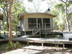  5509 Couran Cove Runaway Bay Qld 4216 Don't wait until summer to secure your position in this idylic island 
location. This freestanding Cowrie Eco Cabin is located central to all 
the resort facilities and just a short stroll to the pristine surf 
beaches of South Stradbroke Island. It has full use of all the Resort 
facilities, two swimming pools, kayaking, tennis, putt putt, table 
tennis, gym, sports centre, kids playground, nature walks, fishing and 
an easy walk or bike ride to the marina. 
 
Close to the Surf Beach 
No Cars on the Island 
Central to all resort facilities 
Marina berth available 
Fully Furnished ready to occupy 
2 bedrooms plus a bunk room. 
 
Spread over three levels the cabin sleeps 8 people and comes complete 
with modern furnishings. The upper level has two bedrooms and the bunk 
room. The mid level has a full sized kitchen and dining room while the 
lower level has an open plan living area and second bathroom. Arrive at 
your holiday destination by boat, what a way to unwind. 
 
For sale at the Bargain Price of $189,000 
 
Cabin 5509 Couran Cove Ramada resort 
 
Contact the agent to arrange an appointment to view 
 
Richard Carter 0413 543 157 