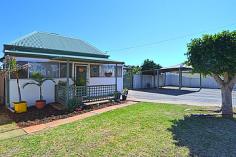  30 Buller Street Kalgoorlie WA 6430 MORE THAN MEETS THE EYE This pretty 3 x 1 central Kalgoorlie home has way more than meets the eye. Situated on a quarter acre block (1012m2) with 20m frontage and rear lane access within the South Kalgoorlie Primary School zone.  The fibro home consists of 3 bedrooms with built in robes to the master bedroom. One bedroom has original pressed tin walls which are delightful. Also inside the home is a study, a sleep-out and a utility room, all of a suitable size. Combined modern, tiled kitchen/lounge area with gas cooktop, electric oven and excellent bench space. Gas heating plus the option of reverse cycle air-conditioner for year round comfort completes this comfortable living space. There is also a formal dining room with new carpet. The bathroom features a bath, shower and vanity with separate WC. As an added bonus there is a second WC outdoors.  Horse stables are in place at the rear of the block plus many bird cages for the enthusiast. 2 workshops and an easy care garden complete with established fruit trees make this an attractive family home. Last, but by no means least, there is a horse stable registration in place for this property until 30/6/2015  General Features Property Type: House Bedrooms: 3 Bathrooms: 1 Land Size: 1012 m² (approx) Indoor Features Toilets: 2 Air Conditioning Outdoor Features Carport Spaces: 2 Other Features Built-In Wardrobes,Close to Schools,Close to Shops,Close to Transport,Garden,Registered Stables $299,000 