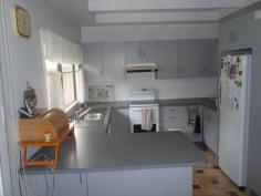  8 Railway Parade Injune QLD 4454 $270,000 Neg. Lowset 3 bedroom home in a thriving small town.Open Plan living area opening onto front verandah. Lounge has reverse cycle air-conditioning, fan & wood heater. Kitchen has electric stove, dishwasher & rangewood. Main bedroom is carpeted, built-ins and ceiling fan. Main bathroom has shower, toilet and another separate toilet. Laundry with linen cupboards. Access to 2 car garage from house! Side verandah with ramp. Huge outdoor area at rear of house with established gardens and palm trees. House is connected to 2 x 13600 Rain Water tanks as well as town water. 8x8 metre steel shed with cemented floors at rear of house with single three phase power. Tenure Type: Leasehold $800 yearly.   Read more at http://roma.ljhooker.com.au/C8HG2#21cyxwuFbI1Flcbi.99 