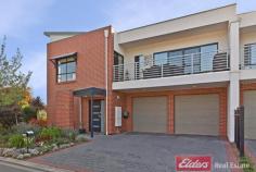  46 Grasswren Way Mawson Lakes SA 5095 $485,000 - $495,000
Elders Mawson Lakes is proud to present this absolutely Stunning Melisi 
Built Townhouse property constructed in 2008 with Brick materials. Rarely
 do we come across such an outstanding Townhouse perfectly positioned on
 a corner allotment and taking full advantage of the neighbouring 
Reserve. A definite stand-out of this property is the clever Floorplan 
design. Taking advantage of the gentle surroundings, this Townhouse 
showcases the Kitchen and Main Living Areas on the Top Floor, providing 
uninterrupted views overlooking the Reserve. This clever design brings 
about a sense of spacious Open-Plan Living complimented by the natural 
sun lighting throughout the entire top floor. The island kitchen 
overlooks the Living Areas featuring a Glass Splash back and Stainless 
Steel Appliances, creating the perfect ambiance for entertaining family 
and friends. This vast open space is further complimented with 
natural timber flooring making the look and feel of this Townhouse 
simply stunning. The Master Suite is also located on the Top 
Floor and includes access to a spacious balcony, perfect for soaking in 
the sun on a lazy Sunday afternoon. Accommodating a Walk-in Robe and 
Ensuite, this master suite makes the ideal Parents Retreat. The 
bottom floor showcases two extremely well-proportioned Bedrooms both 
with Built- in Robes, the Main Bathroom with Bathtub and Laundry spaces 
along with a Double lock-up Garage. 