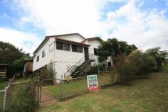  Tyalgum NSW, 2484 Located centrally to the village of Tyalgum, this comfortable residence is waiting for a new family to call her home. Comprising; * Three spacious bedrooms, plus one sleep out * Large eat-in kitchen with marble bench tops and breakfast bar * Renovated bathroom with terazzo flooring with separate shower room and toilet * Polished timber floor boards through out with wood fire stove in lounge room * Low maintenance vinyl cladding on the exterior with brand new corrugated iron room * Single lock-up garage along with additional storage under the dwelling Within walking distance to nearby school and shops, with the added bonus of rear land access, this great family home under $300,000 is well worth an inspection!! 