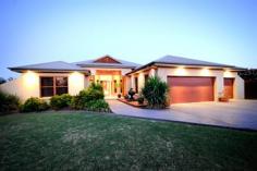  32 Glenabbey Dr Dubbo NSW 2830 Auction 06/11/2014 at 6:00 PM Property: House 	 Bldg: Cement Rendered 	 Land: 2525 Sqm 	 Council: Dubbo 	 Pool: Yes 	 Age: 9 	 Rooms: Lounge/Living Office Rumpus Room Family Room Dining Room 	 Other Areas: Laundry Area- Internal Formal Entry Walk-in-Pantry Courtyard 	 Complex: Barbecue Area 	 Furnished: N 	 Majestic Family Home with Scenic Views Positioned in prestigious Kintyre Estate offering beautiful panoramic views over Dubbo and the Harvey Ranges, this luxurious property with grand proportions is nestled on a peaceful 2,525 sq m block (approx).  The sheer vastness of the family home is immediately impressive with a collection of three living areas, four generous sized bedrooms plus office or fifth bedroom and large elevated entertaining patio overlooking the solar heated inground pool. If you are looking for a lifestyle that affords living without compromise, you must simply inspect this property.  Features: - Four oversized bedrooms - Stunning master retreat includes dressing room/walk-in robe and beautiful ensuite - Office or fifth bedroom - Lavishly appointed bathroom - Centrepiece formal lounge room with magical views - High gloss kitchen overlooking the family and dining areas with vaulted ceiling and views - Huge downstairs games room with impressive bar/kitchenette and third bathroom - Laundry offering loads of storage - Zoned, ducted reverse cycle air conditioning - Natural gas points - North East facing, elevated entertainers patio with superb views - Inground, solar heated pool with entertaining terrace - Landscaped yard providing privacy and including rear utilities storage and fire pit area - Three car garage with auto doors (one bay currently fitted with storage shelving) - Built by Rod Dunkley and hand picked tradesmen - Town water, tank water, town sewer, underground 3-phase power available - Peaceful retreat on a 2,525 sq m (approx) parcel - Elevated views over Dubbo, Harvey Ranges and zoo - Short drive to Dubbo Golf Course, cycleway, private and public schools, Delroy Park Shopping Centre, Woolworths Supermarket and CBD amenities The information and figures contained in this material is supplied by the vendor and is unverified.Potential buyers should take all steps necessary to satisfy themselves regarding the information contained herein. 