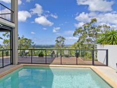  59 Midway Terrace Pacific Pines QLD 4211 $749,000 - $789,000 Owner already moving out - it's time to present your offers! 
Located in the highly sought after Vue 360 precinct, this prestigious 
home sits on a prime block taking advantage of picturesque views of the 
Pacific Ocean and Gold Coast skyline including Surfers Paradise. The WOW
 factor of this stunning home is sure to impress everyone that walks 
through the front doors. This is one of those rare opportunities that 
should not be missed as homes like this don't come on the market every 
day. 
 
Features include: 
 
4 generous sized bedrooms (2 downstairs & 2 upstairs), all with their own air conditioners and ceiling fans 
Large Master bedroom with walk-in wardrobe, it's own balcony overlooking
 the Pacific Ocean, and large ensuite with double vanity, spa bath, 
large shower and heated lamps 
Modern Master bathroom downstairs with deep bath, large shower, and heated lamps 
Lounge/media room with ocean views and surround sound in the ceiling 
Modern open concept kitchen with new Stainless Steel appliances and views of Surfers Paradise with plenty of cupboard space 
5kw German solar inverter & 3kw Canadian solar panels 
Expansive outdoor Alfresco entertaining area with automatic blinds to block out the sun 
High ceilings and balcony upstairs that overlooks the living areas downstairs 
Fully Landscaped yard with fenced pool and wood deck overlooking the ocean & Gold Coast skyline 
Solar heating for the swimming pool 
Double car lock up garage 
Back to base security system & security screens throughout 
Bespoke curtains throughout 
Plenty of storage throughout the house 
Expansive separate laundry 
Rainwater tank to water the gardens 
 
Sitting on a pristine private block with no neighbours behind or one 
side makes this an extremely rare opportunity to claim one of the best 
views on the Gold Coast! Owners are motivated to sell, so don't delay 
book your inspection today! 
 
   Read more at http://pacificpines.ljhooker.com.au/N9GGMK?play=1#XjJyp8xzAG4BxEtu.99 