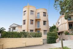  1/65 Birriga Road Bellevue Hill NSW 2023 Peacefully set within 'Olympia', a classic Art Deco block of 12, this north facing security apartment in enviably located just minutes to Bondi Beach and cosmopolitan cafes. Tastefully refurbished to maximize light and space, it features airy and inviting interiors completed by tiled floors and modern features. It offers sunny living/dining room and 'as new' gas kitchen with breakfast bar overlooking the living area, stylish bathroom, internal laundry & peaceful double bedroom with leafy outlook. Within easy reach of Bondi Junction flagship shopping & entertaining mecca, this beautiful apartment is a perfect first home or astute investment property. 