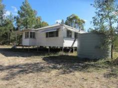  963 Ducklo - Gulera Road Dalby QLD 4405 BUSHLAND HIDEAWAY On market on “as is” basis. Items of furniture included. Position yourself in a central location to QGC activity. Bitumen road at front of property under construction. 35 mins from Dalby township. Close to Moonie Highway. Acreage - 40.23 hectares (approx. 100 acres) 200metres x 2.25 kms. Weatherboard residence (relocated from Ascot in Brisbane) Front porch/entry, with both glass and screen doors. Sunroom with carpet, aluminium windows. 3 good size bedrooms (plus option of sunroom and office as 2 extras) Kitchen with pantry, gas stove, gas HWS, 1.5 sink, cork flooring. Dining room with cork floor, aluminium windows. Large lounge room – carpet, ceiling fan, wood heater. Bathroom with spa bath, shower recess, vanity. Office /study with carpet floor, shelving, fluro light. North-facing back deck. Solar panels (5) on roof. Solar inverter 24 volt (2000-3000 watt) 12 volt (300 watt) Rainwater tanks – 6000 gals on house, 3000 gals on shed. Large shed 12x12 metres with timber floors, work pit section. Carport accommodation for 2 vehicles. General Features Property Type: House Bedrooms: 3 Bathrooms: 1 Outdoor Features Carport Spaces: 2 Negotiable $180,000 