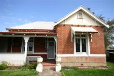  Narrogin WA, 6312 Location Location Location! A rare opportunity has arisen to secure this charming character cottage located within Narrogin's central business district. Currently used as a residence and returning a good rental income the land is zoned "Central Business" which opens up a range of possibillities not available ion a residential zoned property. Situated in a restricted speed zone on a main through road the property lends itself well to a business use or it can be kept as a residential dwelling where the new owners can enjoy a cafe lifestyle within very easy walking distance to shops, cafes, hotels, sporting and other facilities. With a near ground level rear entrance the home could suit a retired couple looking for a character home with a small easy care garden not in a complex. The home has reverse cycle airconditioning to two rooms, electric range cooker and oven, dishwasher and instant gas hot water system.  With a quality tenant in residence the property can be secured now to be further devloped into a business premises at a later date, or contact elders Real Estate to find out when the lease expires so you can move in yourself. Other features: Close to Schools,Close to Shops,Close to Transport,Garden,Secure Parking,Formal Lounge 