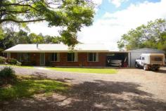  30 Witta Road Maleny Qld 4552 Set at the rear of this 7589m2 block (almost 2 acres) this low set brick
 home has been specifically sited to take advantage of the expansive 
north facing views. This is a very special piece of land and subject to 
new Council regulations and approvals a second dwelling may be 
permitted. The existing home has four large bedrooms all with built-ins.
 Huge views from the kitchen which is combined with the family meals 
area and the separate lounge room has a pot belly stove. There is a 
large laundry and utility area with good storage. The spacious rear 
entertainment area takes advantage of the magnificent outlook. There is a
 20,000 gallon water supply, lock up garage, steel shed & undercover
 caravan parking. There is also plenty of room to keep horses other 
anaimlas or build a huge shed. Less than 10 minutes drive into Maleny 
privacy is guaranteed at this address. 