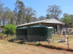  Hivesville Qld 4612 FULLY FENCED DUAL TITLE BLOCK IF IT'S A SOLID BRICK HOME YOU'RE LOOKING FOR INSPECT THIS ONE 4 BEDROOM SPLIT FACE BESSER BRICK HOME LARGE OPEN LIVING PLAN 9MX7M GARAGE PERMANENT WATER BORE SPACIOUS HARD SELECTED FRUIT ORCHARD LOVELY SHADE TREES MINOR COSMETICS REQUIRED ONLY. GREAT PRICE 2 TITLES FOR THE PRICE OF ONE $250,000 " 