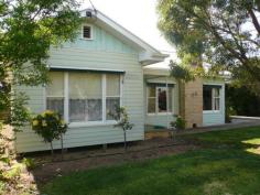  115 Anderson Street, WARRACKNABEAL VIC 3393 $225,000 Well positioned close to schools and park, this low maintenance steel clad home oozes quality and tasteful decor and offers everything a growing family needs. Large formal lounge with OPF + gas heater, ceiling fan & ref a/c; ducted evap a/c throughout; renovated kitchen has elec oven & meals area; adjoining is open 2nd living dining area with S/C heater & split system, leading to covered paved outdoor entertaining BBQ area. Four bedrooms all with robes & fans, master has ref a/c, renovated tiled bathroom has S O B & vanity. Large internal laundry, sep toilet. Lovely garden setting, single garage with roller door & large steel shed/workshop/caravan shed. Outstanding home in every respect - move in and enjoy. 