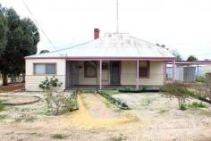  2 Anderson St Dowerin WA 6461 A home for just $89,000 - in a great town - you got it ! Sure, this is no palace, but with some painting, floor coverings, update the kitchen and bathroom and general TLC you will end up with a tremendous home in central Dowerin townsite. The home has a front verandah, lounge, two bedrooms, kitchen/dining, double sleep out to the side, plus a rear sleep out (or office). The bathroom is basic but does have a bath and a shower. The toilet and laundry are in a covered area outside the back door. There is a "Bushman" heater in the lounge, plus an old style air conditioner, and there is a solar hot water system. To the side of the home is a carport, plus three small sheds, and you have rear access to the property from the laneway. Plenty of room for the kids to play, vegies, chooks etc. The home is close to the main street and Dowerin Primary School. This is a home for someone prepared to do some improvements - and to reap the rewards. 