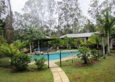  432 Lake Cooroibah Rd Cooroibah QLD 4565 This 2.17 ha site is the setting for this magnificent 8-bedroom home, 
now too large for it's empty nester owners who wish to downsize. 
There is potential for use as a corporate resort, dual home, couples retreat or a B&B. 
The home is surrounded by approx. 1/4 km covered decking which offers 5 
alfresco entertainment areas including a large central breezeway. 
 
Features Include: 
 
506m2 under the roof and 400m2 of covered verandahs 
High Cathedral ceilings, double sliding doors throughout 
Large sitting room with dining area, second area as bar. 
Master suite privately on first floor with dressing room and ensuite 
Second Master suite plus six further bedrooms, 6 bathrooms 
Large working office with access to verandah 
Generous outbuildings, capacity for 11 cars, workshop 
Large resort style pool with waterfall and gazebo 
Dam, solar hot water, 3 phase mains electricity. 
Noosa 12 minutes drive from shops,beaches, schools.
 