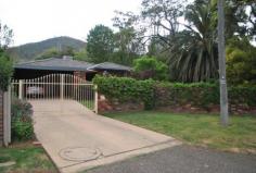  42a Dowell Avenue Tamworth NSW 2340 TUCKED AWAY IN QUIET AVE - CENTRAL EAST! Occupying a prime central East Tamworth location this private family residence sits on a level 721sqm block in a leafy, whisper quiet street within walking distance to Anzac Park, Treloar Tennis club & the CBD. The home is approx. 35 years old & has been well constructed & is erected on a reinforced concrete slab with no movement evident. The brick veneer & terracotta tile home offers a front fence providing excellent security & privacy & also allows an extension of secure yard space, double front gates allow easy access to the double car accommodation, there is a choice of formal & casual living areas in the home which includes lounge, dining, family & meals areas & the very tidy kitchen offers a walk in pantry & dishwasher & is well situated allowing easy access to all living areas. There are 3 bedrooms in total plus an office, the master bedroom offers a dressing room with substantial storage & hanging space & a renovated ensuite, bedroom 2 has a built in with an attached separate room, presently used as a sewing room, bedroom 3 is spacious, the main bathroom presents well & there is a 3rd toilet off the laundry. Additional features include gas log fire, evap. cooling, natural ... show more View Sold Properties for this Location View Auction Results General Features Property Type: House Bedrooms: 3 Bathrooms: 2 Land Size: 721 m² (approx) Indoor Features Alarm System Outdoor Features Carport Spaces: 2 Swimming Pool - Inground Other Features Built-In Wardrobes,Close to Schools,Close to Shops,Close to Transport,Garden AUCTION 