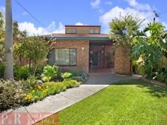  1/2 Gardinia Street Beverly Hills NSW 2209 ENORMOUS BRICK HOME ON 3 LEVELS THE PHOTOS, FLOOR PLAN & DESCRIPTION DO NOT DO THIS PROPERTY JUSTICE - YOUR INSPECTION IS HIGHLY RECOMMENDED TO APPRECIATE THIS TRULY MAGNIFICENT HOME POSSIBLE IN-LAW ACCOMMODATION/GRANNY FLAT 5 LARGE BEDROOMS - 2 KITCHENS - 3 BATHROOMS - OPEN PLAN LOUNGE/DINING AREA - FORMAL LOUNGE ROOM The property is an enormous and extremely well maintained brick home in a very sought after quiet location. There are 3 large bedrooms on the entry level, plus 2 big bedrooms upstairs with built-in wardrobes. There are 3 immaculate bathrooms, one on each level of the house. The main open plan lounge/dining/kitchen area is very spacious with high ceilings and sliding doors that open to a huge verandah (30 sqm Approx.), with a sought after Northerly aspect and very pleasant district views. The kitchen has been tastefully renovated with quality Miele appliances, gas cooking, ducted exhaust, dishwasher, long breakfast bar and plenty of cupboard and bench space. There is a huge granny flat/in-law accommodation on the ground floor with a near new kitchen with gas cooking/ducted exhaust & tastefully renovated bathroom. The granny flat has doors that open to a very large covered entertaining area. The backyard is a good size and low maintenance with a lovely vegetable patch and a sought after & sunny Northerly aspect. There is a wide driveway to a very sheltered double carport with a gate and a door that provides access to the backyard. The property has many sought after features such as a quality built & custom made timber staircase, covered entrance, large entry foyer, wine cellar, lots of extra storage space, ducted air conditioning back to base alarm system, to name a few. VERY RARE OPPORTUNITY TO PURCHASE A VERY SOLID AND SUBSTANTIAL HOME IN THE AREA 