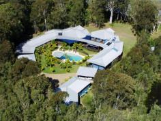  432 Lake Cooroibah Rd Cooroibah QLD 4565 This 2.17 ha site is the setting for this magnificent 8-bedroom home, 
now too large for it's empty nester owners who wish to downsize. 
There is potential for use as a corporate resort, dual home, couples retreat or a B&B. 
The home is surrounded by approx. 1/4 km covered decking which offers 5 
alfresco entertainment areas including a large central breezeway. 
 
Features Include: 
 
506m2 under the roof and 400m2 of covered verandahs 
High Cathedral ceilings, double sliding doors throughout 
Large sitting room with dining area, second area as bar. 
Master suite privately on first floor with dressing room and ensuite 
Second Master suite plus six further bedrooms, 6 bathrooms 
Large working office with access to verandah 
Generous outbuildings, capacity for 11 cars, workshop 
Large resort style pool with waterfall and gazebo 
Dam, solar hot water, 3 phase mains electricity. 
Noosa 12 minutes drive from shops,beaches, schools.
 