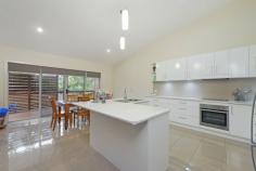  1/25 Kingfisher Road Port Macquarie NSW 2444 For Sale - $389,000 bed 3  bath 2  car 2 Property ID: 	 1P1487 Property Type: 	 Villa Garage: 	 2 Construction: 	 Brick veneer Outgoings 	 Council Rates: $2600 Yearly Features: 	 Built-In Wardrobes Close to Transport Close to Shops Close to Schools Ensuite STUNNING DESIGN WITH A BUSHLAND BACKDROP At Kingfisher Drive you will find this beautifully finished three bedroom villa in a complex of only 2 that cleverly combines modern architectural design elements with functionality.  The property features a modern facade with timber features set against the hues of a contemporary Australian coastal design. Stepping inside, you are immediately impressed by the quality of the villa's inclusions and also the unique design features that create a sense of light and space. High gloss floor tiles feature throughout with a stunning open plan living area opening out on to a timber deck. Here you can fully appreciate the architectural elements that make this villa special, with soaring skillion rooflines and design features that fill every room with natural light.  There is a separate dining-family area that seamlessly integrates with the contemporary kitchen. The kitchen features beautiful stone benchtops, an L-shaped island bench, electric cooktop, high raked ceilings and beautiful pendant lighting.  There are three queen sized bedrooms with the master featuring a flawlessly finished open plan ensuite with cantilevered vanity, corner shower, generously sized built-in robes and a feature void that fills the room with natural light. The same quality extends to the main bathroom which comes complete with sizeable linen storage.  There is a rear deck leading down to a low maintenance grassed area. This property is just minutes from town, shops and schools and the new University is just so close. Live in or invest, currently returning $395pw to an excellent tenant who would love to stay on.  Council Rates $2,600pa  Strata is newly registered (shared costs of insurance only) 
