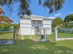  14 Seventh Ave South Townsville QLD 4810 Early 1900's Queenslander Classic!!! Auction Details: Sat 20/12/2014 10:30 AM "Phone for an Inspection". STREET AND 2 LANEWAY ACCESS!!! If there is an Auction you must attend and be an active bidder at this year it will have to be this one. Being held at 10.30am on Saturday 20th December this would be the perfect Christmas present for the family. Structually sound and with the addition of a few modern conveniences you could be in your new home straight away.  Built in the early 1900's this home has a lot of history and has seen some changes along the way with the old timber gidgee post having been replaced with concrete and steel stumps. Also the front verandah has been closed in and turned into a sleepout. The original railings and fancy carved fretwork have been preserved and are covered over making it easy to bring back to the original look. (Refer to the black & white photo)  There are three bedrooms, combined dining and kitchen, separate lounge plus bathroom upstairs with a separate toilet. Downstairs is lockable with room for one car, plenty of workshop space, laundry and a second toilet.  
