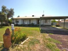  24 McIntosh St Echuca VIC 3564 If you think the block's big, wait till you see the shed! Situated on a large 1,300sqm (approx) allotment, is this neatly presented three bedroom home.  Boasting master bedroom with built in robes and ensuite and the further two bedrooms also with built in robes.  With a central kitchen, adjoining meals area, cosy living room and small rumpus/ sitting room there is plenty of room for the whole family.  The home's temperature is maintained year round with gas wall heater, open fire place and ducted evaporative cooling.  Outside boasts double carport, 4x5m shed with concrete floor and power and located to the rear of the large yard is a sensational 11x7m shed boasting concrete floor, power, 3 remote powered roller doors, evaporative cooling unit and access to the lane way that the property backs onto.  Given a little TLC this home is sure to appeal to any buyer whether you are first home buyer, investor, renovator or developer.  With the potential to fence off the allotment and rent out the house and use the shed for storage or vice versa, this opportunity is too good to miss.  Currently tenanted until May 2015 and returning $260 per week  