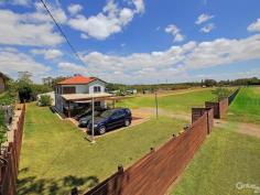  32 Burringbar St Hemmant QLD 4174 Where else can you have 10,900 square metres of relatively flat ground with access to Bulimba Creek ? A Rural property only 10 kilometres from the City, 10 km from the Port of Brisbane, 7 km from The International Airport,6km to Bulimba,6km to Manly Boat Harbour and with easy access to the Gateway Motorway, Golf Course, Train Station and a variety of major Shopping Centres. This Property is quite unique.  Bulimba Creek at your backdoor. Yes there is a pontoon which provides a private mooring for a couple of small boats. The owner has caught many a crab and plenty of prawns in the creek. What a great lifestyle exploring the waterways around you (this joins up with Aquarium Passage and the Brisbane River).  Yes the lifestyle is yours to create with over 2 acres of rural options. Horses, Cattle, fruit trees, small crops ? which ever you choose. There are already rows of Pawpaw, Banana and Apple Guava and room for plenty more. Become self sufficient and have vegetable and herb gardens or seasonal fruit. There is a chicken coop and as expected room for more!  This is Rural zoned land with many options available for the Entrepreneur, Home business operator, Horse owners, car enthusiasts, Building contractors, owners of earth moving / transport equipment or Business owners who require extra space. There are two dwellings adjoined by a walkway both recently refurbished with modern bathrooms and kitchens. Unlike many acreage's this property has the benefit of being connected to town water and sewerage. The rain water is collected and is available for irrigation.  What an ideal opportunity to enjoy a rural atmosphere while only moments from the convenience of the City / Bayside Lifestyle. The Vendor is open to offers prior to the Auction on Saturday 6th December at 3:15 pm. See you at the open for inspection or contact Jon to arrange your private viewing. Please note that the improvements erected on the land or any part of them may have been constructed without local authority approval. 