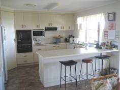  13 Aplin St Point Vernon QLD 4655 ID #: 0000245331 Price: $675,000 Type: House Bed: 4    Bath: 3    Car: 2     Land Area: 1095 sqm (approx Relaxed living with this balanced designed two storey residence perfect for dual living. Downstairs Large double garage with internal access to entry, spacious lounge with kitchette, separate laundry, bathroom and external covered patio over looking Esplanade with sea views and parkland. The spacious upper level has open plan lounge/family, kitchen/dining overlooking ocean with access to large covered verandah with sea views . All bedrooms have built in robes, Master has access to verandah, There is separate laundry and spacious bathroom. This property represents excellent value at $675,000. A recommended R&W purchase. 