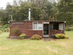  25/137 Winduss Road Gunns Plains Tas 7315 $40,000 Property Information Need somewhere to get away from the hustle & bustle? Somewhere for the kids to get close to nature? Then do we have the place for you! Located with the iconic Wings Wildlife Park on the edge of a picturesque creek & a stones throw from fishing in the Leven River. This complete cabin has everything you could need and comes fully furnished. Some of the items included are a 4 burner BBQ, twin tub washing machine, TV & DVD player, lawn locker, beds, dining furniture, crockery & cutlery. The cabin is divided into specific areas; 2 bedrooms, kitchen/dining area, lounge area, 2 cosy decks and a toilet and shower area. For more specifics on this little "Love Shack" please give me a call. Floor Area 	 80 sqm Tenure 	 Leasehold Details (Leasehold) Property condition 	 Good Property Type 	 Unit House style 	 Cabin Garaging / carparking 	 Off street Construction 	 Timber and Cladding Joinery 	 Aluminium Roof 	 Iron Insulation 	 Walls, Ceiling Walls / Interior 	 Panel sheeting Flooring 	 Carpet Window coverings 	 Drapes Heating / Cooling 	 Woodfire (Closed) Chattels remaining 	 Bar-Be-Que Twin tub washing machine Small water tank Lawn locker-shed All furniture crockery & cutlery Free-standing wood heater, Drapes, Fixed floor coverings, Light fittings, Curtains Kitchen 	 Original, Gas bottled and Finished in Timber Main bedroom 	 Double Bedroom 2 	 Double Laundry 	 Separate Views 	 Water, Rural, Bush Aspect 	 West Outdoor living 	 Entertainment area (Covered, Partly covered and Other surface), BBQ area (with lighting), Deck / patio Fencing 	 No fencing Land contour 	 Flat Grounds 	 Tidy Garden 	 Garden shed (Sizes: 2mx1.5m, Number of sheds: 1) Water supply 	 Town supply, Tank Sewerage 	 Envirocycle 