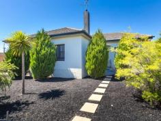  4 Theodore St Flora Hill VIC 3550 $260,000 - $280,000 Top Location with Nothing to do A QUIET area close to the CBD is where you'll find this well-presented low-maintenance home; an investment property, a wonderful first home,  anything's possible here. The colour of the newly laid bark chips in the front garden ties in really well with the home's charcoal window frames and together with the pale rendered finish makes for a striking street presence. Conifers planted six years ago have clearly taken to the soil and happily shot up in that time.  A bright and airy interior is a pleasant surprise, although not entirely unexpected, as this style of home is known for its brilliant natural light.  Polished hardwood floors line the hallway and continue into other rooms. Generous in size, a lounge room at the front features a lovely brick-faced  fireplace with provision for a gas or electric heater. Wall-lit niches either side add a special ambience.  There's also a reverse-cycle split-system for exra comfort. Double glass doors open from here to another room that could be a study, dining or third bedroom. A modern and spacious kitchen is adjacent. A long dark benchtop provides plenty of working space and runs along one wall with cupboards below. Stainless steel appliances have been installed. They include an electric underbench oven, gas cooktop and an LG  dishwasher. There's also a roomy walk-in pantry. Opposite the kitchen is a modern two-piece bathroom with vanity and separate shower. White wall tiles with a decorative frieze give this room  a crisp look. A two-door linen cupboard is nearby. Two bedrooms are along the hallway. Both have ceiling fans while the main is easily big enough to accommodate a king-size bed. At the rear of the home is a vestibule with a laundry off this, both with double brick walls. The back door opens to a private east-facing paved  patio filled with sunshine.There's room for three cars in the driveway. Book your inspection with the agent today to secure this prime investment 