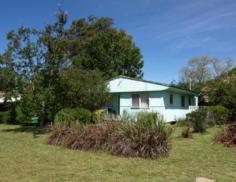 18 Market Street Tahmoor NSW 2573 Price: $365,000 Located close to town on a level 1012m² corner block is this potential gold mine! At present there is a renovated (inside) two bedroom home, one with built in robe, basic kitchen and bathroom, good size living area with split system r/c air con and polished timber flooring throughout. There is recently completed kerb and guttering to one frontage and all services available. Please note this property is currently tenanted and require 48 hours notice prior to inspections. 