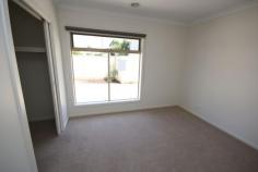  2/9 Form Street Wendouree Vic 3355  $269,950 Great Inner Wendouree Location Townhouse - Property ID: 777803 *Top spot close to strip shopping center *Over 10 sqs of living *Two bedrooms with BIR's *Having a 2.5 sqs garage with electric roller door *Gas central heating *Fully tiled and carpeted *Chain controlled window furnishings *Concrete driveway *Landscaped gardens and surrounds  