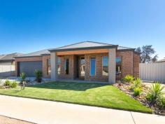 26 Garden Dr Huntly VIC 3551 $450,000 - $495,000 Glamour on Garden Looking for that special property that has glitz and glamour, both inside and out? A home with stylish modern design, with room for the family, on a big block with a shed and side access? Then look no further and keep reading, this property just might be for you.  Stained timber window frames sit attractively in the brickwork and complement the timber frame of the front door. The interior features a palette of darker floor colours contrasting with white walls and cabinetry. Timber-look vinyl floors are along the entrance and in the huge open-plan living spaces. The main bedroom is massive and has a spacious walk-through wardrobe into a dazzlingly beautiful en suite with shiny black wall tiles, a luxurious extra-wide shower with a stunning metallic tile inset on the back wall and two showerheads, so good you won't want to come out.  A formal lounge room is opposite the main bedroom. Past a two-door linen cupboard is a wonderful living and dining space flowing from the kitchen. Dark Caesarstone benchtops partner with silk-finish laminated surfaces on the cupboards and the  waterfall ends of the island bench, which also doubles as a breakfast bar. The white tiles of the splashback provide a crisp contrast.  A 900mm Technika electric oven teams with a gas cooktop and a dishwasher. From the kitchen, a fabulous walk-in pantry with great storage awaits and a door here leads to the double garage - a clever design detail. Three bedrooms with built-in wardrobes, a three-piece bathroom with a luxuriously deep bath, a laundry and separate toilet complete the layout. The amenities just keep getting better. The large family room opens to a 6 x 6-metre undercover alfresco entertaining area with caf blinds on two sides and a timber bench along one. Even with two sheds with lock-up roller doors in the backyard there's still loads of room to create a dream project or two. And all this in booming go-ahead Epsom. 