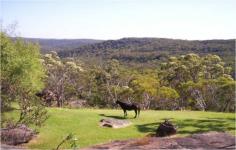  13 Chiltern Rd Ingleside NSW 2101 Nature As Far As The Eye Can See This exceptional 5 and a half acre block in Ingleside overlooks possesses uninterrupted views of Ku-ring-gai National Park and a wealth of opportunity. The tranquillity and retreat like ambience of the property and the lodge like accommodation will have you in disbelief that you are only 30 minutes from Sydney CDB and 5 minutes to a number of local shops, restaurants, cafes, beaches, sporting facilities and retail outlets.  With a 3 bedroom home that already allows for 2 self contained areas you it would be perfect for visitors or families looking for a dual occupancy home. The home has been designed on the North-Eastern side of the property and manages to capture the magnificent views of Ku-ring-gai National Park from every area.  The property itself has an area suitable for an arena, stables, fenced paddocks, garaging for 2 cars and carport for 8 more, established dams and ceremonial area for events such as weddings. There is so much more that the astute buyer could do at Rainbows End with fantastic development potential or Bed & Breakfast style retreat possibilities (STCA).  Take advantage of the unique Northern Beaches opportunity and live a holiday everyday 