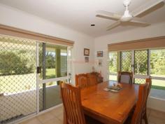  34 Thomas Ct Bulgun QLD 4854 $450,000 SPACIOUS LIVING ON LARGE BLOCK BORDERING CREEK This well presented 3 bedroom home has a lot to offer in the way of serene surroundings as well as proximity to the centre of Tully, approximately 10 minutes drive. The block is approx. 8002m2 in size. Tiled throughout and with verandahs around three sides for shade from Easterly and Westerly sun, this home has a coolness even on warm days.  The sleek, modern kitchen accomodates barstools and is a great size for those who love to cook and entertain. A viewing window through to the living room ties both spaces together and makes sure that light as well as conversation flow through to the living space. Views from the dining table are that of beautiful green rainforest foliage and distant mountain ranges. Adjacent to the kitchen, the large office space has access to the back patio.  3 bedrooms all feature built-ins with mirrored sliding doors. A vast amount of storage is offered in this home with floor-to-ceiling cupboards running the length of the hall. The bathroom offers a shower and single vanity with separate toilet adjacent. The laundry is a great feature being so large in size and boasting an internal clothesline for those grey Tully days.  The double bay remote operated roller door garage is a great asset to the property featuring a small kitchenette and a drive through roller door to the backyard as well as the ability to park 4 cars comfortably. The driveway has ample facilities for off-street parking and is well maintained, just like the gardens . The back patio has a bench and sink configuation which is currently being used for gardening purposes, but could easily serve as part of an outdoor kitchen if needed. The back yard also features a good size garden shed for all your gardening and hobby storage solutions. This house has a lot to offer and is definitely worth a look. For any enquiries do not hesitate contacting one of our friendly sales team at LJ Hooker Tully (07) 4068 1100   Property Snapshot  Property Type: House Construction: Concrete Block Zoning: RESIDENTIAL (RURAL) Land Area: 8,002 m2 Features: Built-In-Robes Established Gardens Garden Shed Outdoor Living Remote Control Garaging Renovated Security Screens Storage Undercover Entertainment Area Verandah 