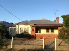  14a Phillip Street TAMWORTH 2340 $205,000 One of those traditional West Tamworth beauties. Just what you have been waiting for.  All the charm of yesteryear including lead-light windows in the front, high ceilings, use of some ornate cornices, open fire place, mostly constructed of cypress pine timbers, front and rear verandahs and a nice sized yard with rear lane access.  Ripe for renovations to suit your budget, there is an original kitchen and bathroom plus a second toilet outside, two bedrooms plus an external sleep-out off the rear verandah, gas instant hot water system plus a terrific 9m by 6m colorbond shed with two roller doors from the rear lane.  This home is in surprisingly good condition for it's age and should not disappoint the discerning buyer. Be convenient to shopping, transport, churches, clubs and schools.  Don't dream, you may miss out. Call Tamworth Real Estate today on 02 6766 3399.     PROPERTY DETAILS Property Id: 61465500 Land Size: 720.8 Metres² Municipality: Tamworth Regional Council Available: March 7, 2015 