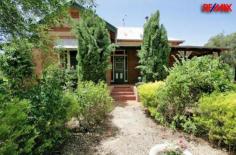  408 Marrar Road Downside NSW 2650 Price $549,000 SPARKLING POOL - CHAMPAGNE LIVING 'Kiaora' - Federation Circa 1910 is positioned on 5 acres just 4km up the Marrar Rd and approx. 15 minutes out of Wagga. This 100 year old fine vintage residence beams with colossal charm and federation qualities that are truly outstanding. Simply irresistible, this resort - like residence in the middle of rolling countryside makes privacy absolute and presents a lifestyle of country charm. With an impressive central hallway, high cedar ceilings, wood fires, ducted cooling and stained glass windows, this is only the beginning! Filled with personally, you'll be invited through stunning brick walls that have stood the test of time. The key is the kitchen which is designed for a creative cook, which shines with style and practicality. Formal and informal light filled living areas of exceptional proportions provide a continuous flow of space for your family. Commanding master bedroom with a large en-suite with spa plus a main bathroom that's distinctly unique... Entertain your family and friends in a relaxing undercover area, which overlooks a magnificent in ground salt pool. The ultimate outdoor experience with a romantic winding garden full of surprises which changes with the seasons.  Versatility is another merit with a completely self-contained granny flat with 1 bedroom and 1 bathroom providing endless options for a growing family. A great carport, which will house 4 cars plus powered shedding for the man of the house. This rural princess is a residence of great character and offers a unique flavor that you'll fall in love with!  Property Features Property ID 	 12024423 Bedrooms 	 5 Bathrooms 	 3 Garage 	 4 Land Size 	 5 Acre approx 