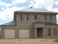  29 Errington St Wallaroo SA 5556 $650,000 - $680,000 TWICE THE NORMAL HOME House - Property ID: 691784 This is a quality built steel frame Weeks Peacock home that offers 2 levels that could be lived in separately. The lower level has stunning kitchen, only the best appliances and soft close drawers, large walk-in pantry with large meals and living area with sea views. The master bedroom has wir and ensuite that is more the size of a bathroom.  Upstairs offers 4 more double bedrooms, linen press the size of a small bedroom, 3 way bathroom with double basin and its own kitchenette and a large entertaining deck to enjoy the sea views of Wallaroo Bay. The homes 3 WC's all have soft close lids, there are also 2 r/c ducted a/c units (1 for each level), security roller shutters, 2 banks of solar panels (9 KW), double garage UMR and 11m x 6m garage suitable for large boats. The garden is yours to create depending on how much maintenance you are looking for. This is a quality package that has to be inspected to be appreciated.  Print Brochure Email Alerts Features  2 Levels, top with sea views  Quality appliances  2 levels could be lived in separately  Solar Panels  2 x Reverse cycle ducted air conditioners, one for each level 