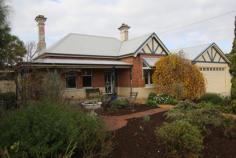  8 Clive St E Katanning WA 6317 $375,000 Character on Clive House - Property ID: 798866 This turn of the century, Federation home features 12 foot (3.6m) ceilings throughout, ornate ceiling roses, picture rails, large skirting boards, restored fireplaces and the original maid's bell. The house has been fully renovated and has incorporated many modern features in the original styling of its era. The original home includes three bedrooms, loungeroom with a slow combustion wood heater, large open plan kitchen/dining plus a generous family bathroom with a clawfoot bath and hidden laundry.  A modern enclosed patio extension has been recently completely which includes a large patio, fourth bedroom, bathroom and storeroom. The house is set on a acre block with a fully fenced backyard, neat cottage gardens, a large shed with attached family room, verandahs on three sides, paved areas, garden shed, double garage, cubby house, chook yard and an outdoor entertaining area. This home is ready to just move in and enjoy, all the hard work's been done.   Print Brochure Email Alerts Features  Land Size Approx. - 1179 m2  Close to Shops  Close to Transport  Fireplace(s)  Garden  Secure Parking  Close to Schools 