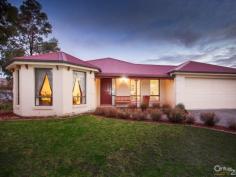  35 The Pkwy Pakenham VIC 3810 $420,000 Sun Drenched Family Home – Lakeside Inspection Times: Sat 04/07/2015 12:30 PM to 01:00 PM Relax, entertain or play, it's all here...  Be quick to view this outstanding family focussed home in the prestigious Lakeside estate. Sitting proudly on this 600SQM approx block is this enchanting 4 bedroom home offering 27SQ's approx (URL) and plenty of space for all to enjoy.  The country style street appeal is only enhanced with a front verandah and plantation shutters. The welcoming entrance forms part of the 7.0m x 4.7m front living room, ideal for all your family entertainment needs. The second living space is open plan so also offers a dining area and large kitchen. Appliances include a dishwasher, under bench oven and gas cook top, with plenty of cupboards and a walk in pantry to satisfy your storage needs. This naturally light filled part of the home then leads seamlessly outside to the main verandah, gardens and play area featuring a sandpit and swings.  The master bedroom is just that, spacious, sunny and inviting with a WIR and ensuite, a sanctuary you won't want to leave. The second bedroom also features a WIR making it perfect for a teenager, while the third has a freestanding robe and the fourth a BIR.  The long list of extras includes a double remote garage with rear roller door, GDH, Evaporative cooling, energy saving LED lighting throughout, a small shed and a programmable irrigation system for easy garden maintenance.  A true family home to be enjoyed so don't miss out! 