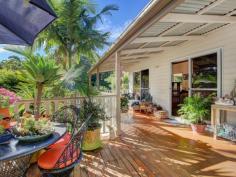  14 Vista Park Dr Buderim QLD 4556 $635,000 Perfect Queensland Lifestyle with a Rainforest Backdrop You will love this character-filled home from the minute you enter and the light floods in on the timber floor, highlighting the green rainforest Backdrop beyond. While it is only minutes from the top of Buderim, you have the sense of being in a lush rainforest setting visible from every room. Ten minutes from the beaches of Maroochydore and Mooloolaba, this is the private oasis you have been looking for. The home is ideally suited for family life with good separation in the bedrooms, and indeed downstairs is ready for long term guest or family with large space plus it's own bathroom. At present, there is parking for two cars but there is plenty of room to expand on this and create parking for a boat or caravan. Private walkways through the gardens and onto a flat grassed area make this a very special lifestyle package. | 4 bedrooms with 2 bathrooms | Timber floors & wide verandahs onto the forest | Dual Living opportunity | Big block of 1,228m2 | 5KVA solar | Room for caravan or boat 