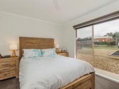  65 Bickford Rd Grovedale VIC 3216 $340,000 - $360,000 It's All Done; so Take it Easy This fantastic home is ready to make your life easier. A central position and updated interiors create a wonderful package for busy families. With the Burdoo sporting reserve, train station, new bypass, community garden, schools and Heyers Rd shopping all close by, it's easy to see how this great position can help you recapture your precious time.  Extensive updates leave nothing to do and cover all the big ticket items including soft new carpeting, fresh paintwork, revamped kitchen and bathroom, and modern roller blinds. Stylish interiors are matched by a great floorplan that gives the family 2 living areas and a large alfresco to enjoy.  The home opens to the family-sized lounge and flows through to the open-plan living, dining and kitchen. The smart kitchen will win all hearts with black bench-tops, crisp white cabinetry and new stainless steel Westinghouse upright cooker and matching dishwasher. The spacious alfresco is a great place to entertain, and with a wall mounted TV on offer, this is where you'll barrack for your team on Grand Final day.  The sun-drenched master bed has a walk-in robe and en suite-style access to the practical 2-way bathroom. The light and cheerful bathroom has a semi-frameless shower and bath, and a door to the renovated powder room. The 2nd and 3rd beds have built-in robes and ample space for bunks or queen beds. Mod cons include a new gas hot water service, gas wall heater, a powerful split-system air conditioner and 8 bill-reducing solar panels with a 2kw inverter.  The low-maintenance garden has a huge lawn with plenty of space for kicking the footy with the kids. Two large sheds offer plenty of storage and give the gent's a space to call their own. Secure parking is plentiful with a single garage with roller door and a 2nd gated drive that gives handy access to the garden and secure additional parking for trailers, caravans and vehicles.  Are you ready to take it easy? **** All information offered by Ray White Geelong is provided in good faith. It is derived from sources believed to be accurate and current as at the date of publication and as such Ray White Geelong merely do no more than pass the information on. Use of such material is at your sole risk. Ray White Geelong does not have any belief one way or the other as to whether the information is accurate and prospective purchasers are advised to make their own enquiries with respect to the information that is passed on. Ray White Geelong will not be liable for any loss resulting from any action or decision by you in reliance on the information from Ray White Geelong. 