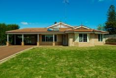  40 Hospital Ave Manjimup WA 6258 $460,000 Ultimate family home with amazing patio and sheds, situated on 2051m2 House - Property ID: 814703 This property boasts size!! With a comfortable modern brick and tile home built by Parella Bros. that features 4 bedrooms and 2 bathrooms. The master bedroom is of large size with a beautiful bay window, walk in robe and ensuite that is well finished and even includes a spa. The other three bedrooms are all of medium size with built in robes and vinyl flooring, perfect for a young family.  Open style living with the kitchen working in perfectly with the dining and the family room. The kitchen is well sized with a 900mm stainless steel electric oven and gas cook top with matching stainless steel range hood. A double pantry and open fridge bay of which will also accommodate your freezer. Fantastically designed with shoppers entrance from the double carport at the front. The living area has a wood fire, ceiling fan and sliding glass door access to the patio, perfect for your entertainment requirements. Separate to this open living is the formal lounge which is perfectly tucked away and like the entire home has beautiful large windows to soak up this beautiful block. This 2051m2 block is set up so well. With the double carport leading to a large "L" shaped patio area of nearly 150m2. There is secondary access to the property that leads to the sheds, the main shed is 6m x 12m with cement floor. This shed features both 10 and 15 amp power outlets. The second shed is 3m x 12m and 4.5m high with cement floor, perfect for your caravan or boat.  With all this there is still plenty of space out the back and at the front of the home for your children or pets. The back yard is fully enclosed with quality fences. With the added convenience of a solar hot water system which also runs through the wood fire (and additional electric booster), batts insulated ceiling and recently replaced gutters and down pipes what more could you ask for. This property has everything a family could wish for. Don't miss out on such a fantastic opportunity.   Print Brochure Email Alerts Features  Land Size Approx. - 2051 m2  Built-In Wardrobes  Close to Schools  Close to Shops  Close to Transport  Fireplace(s) 