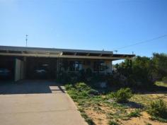  8C Penn St Kalbarri WA 6536 Investment Opportunity in Penn Street This 2 bedroom, 1 bathroom unit forms a one part of a triplex. Located on a roomy, corner 554sqm block, this unit is close to the Golf & Bowls Club & there is plenty of room for a shed. The kitchen, dining, lounge area is open plan & quite large for a unit, with Air Con & a ceiling fan for comfort. There is a bath/shower in the bathroom & an extra shower in the laundry. The outdoor front patio area is the perfect place to sit back & enjoy the Kalbarri lifestyle, overlooking bush land so you will have the company of all sorts of animals. With a little TLC inside & out, this unit has the potential of being a great investment as a permanent rental, holiday rental or as your first home. Call John for more details today 0427 371 161 
