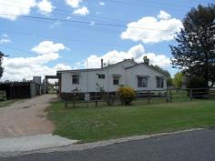  14 Curr Road Stanthorpe QLD 4380     $165,000 	 Grab this -has to be sold!! Ballandean - just 15 minutes direct drive to Stanthorpe. Sure it needs work but look where it is - the bones are already here to make this a top spot - 3 bedrooms, sep lounge with wood heater + reverse cycle air conditioning, spacious kitchen and family bathroom, great separate family room.  Real bonus is the extra large shed ( 12 x 8 x 4.2 high) - to fit trucks - has concrete floor and power! Plus extra smaller sheds for storage/workshop etc, rain water tanks.  Great spot overlooking sports oval and open space on easy care 1,151m2 plus easy walk to primary school/ local shop/chemist/post office and Tavern!  What a start - asking just $165,000. Sellers have said "Must sell" ...so go for it NOW. This is an opportunity too good to miss! Call Anne Lindsay on 0418737309. Features Indoor entertainment area Safety Switch   	 Fenced Smoke Alarms Property Details Bedrooms 		 3 Bathrooms 		 1 Garages 		 3 