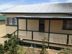  20 Granite St Stanthorpe QLD 4380 Don't want a unit? Well here is the ideal alternative for you!!! A definite sale is wanted as owners plans have changed - reduced to $215,000 neg. Tucked away on easy care fenced 807m2 with such an easy stroll to town and to Quart Pot Creek Parklands and walkways. Just a great location! It has all town services - low maintenance in top condition - 2 built in bedrooms, open plan living area with wood heater - good up to the mark kitchen and bathroom with laundry- top presentation and quality. Great covered rear full length verandah plus front deck with perfect N/E aspect - these areas give extra living and outdoor space! Double lock up shed with power, concrete floor and one remote controlled door with storage plus extra L/U adjoining storage space!. Easy to look after grounds with attractive granite boulders adding to its local appeal. This is a top spot - stroll to parklands and walkways and on to town! Excellent tenant paying $230 per week til early November with strong possibility to wish to continue! So ideal to live or as investment plus the prefect weekender - enjoy, then close the doors! Walk to everything!. Easy care - ideal town living with low maintenance - very central location yet hidden and private! Here is a great opportunity for an alternative to unit living - position, property and price! Now just $215,000. Call Anne Lindsay on 0418 737309. #9095 Features Low maintenance Smoke Alarms   	 Fenced Undercover outdoor area Safety Switch Property Details Bedrooms 		 2 Bathrooms 		 1 Garages 		 2 Land Area 		 807 m2 