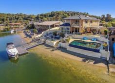  18 Bosun Blvd Banora Point NSW 2486 $1,249,000 OXLEY COVE - SERIOUS BOATIES DEEPWATER POSITION Be boating, skiing and fishing within 2 minutes in the beautiful main Tweed River with no speed restrictions and easy ocean access. The large entertaining home with outdoor covered entertaining area and BBQ patio sits on a spacious 846m2 corner lot with 27m frontage to deep water and sandy beach. Side access to back the ski boat down to the concrete boat ramp. The pontoon can hold a 40-50 ft craft. Live the dream at below replacement cost if you could get a vacant lot that is. - Infinity wet edge in-ground pool - Water views from living areas, kitchen + large main bedroom - Gourmet kitchen with granite bench-tops - Ducted air conditioning - Solar hot water - Security system - Room to park extra vehicles - Fully fenced front yard - High ceilings - Study Price 	 $1,249,000 Suburb 	 Banora Point Region 	 Northern Rivers Postcode 	 2486 Property Type 	 House Sale 	 Private Treaty Bedrooms 	 5 Bathrooms 	 3 Carspaces 	 2 Land Size 	 846 m2 